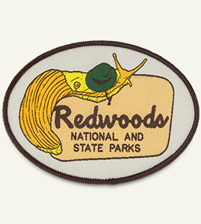 woven patch with an image of a snail and the text Redwoods National and State Parks printed on it